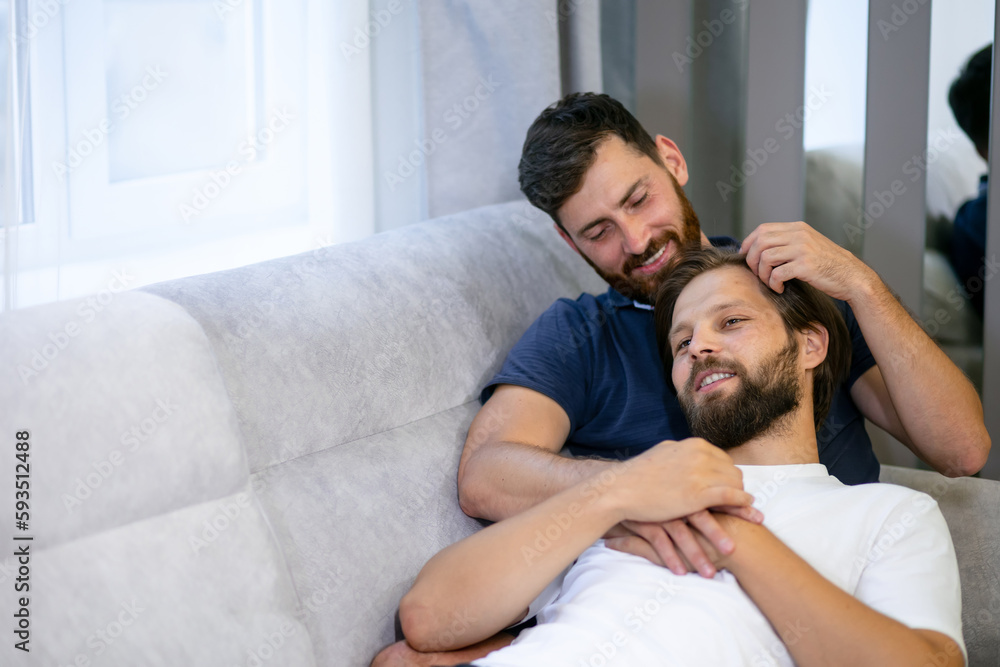 Young sweet couple have same-sex romance, embracing in bed kissing, passionate active man catches his boyfriend in cuddle, honeymoon, LGBT concept. Young sweet couple have same-sex romance, embracing in bed kissing, passionate active man catches his boyfriend in cuddle, honeymoon, LGBT concept.