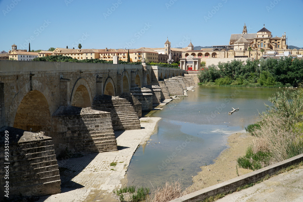 Roman bridge on Guadalquivir River and Mezquita Mosque - Cathedral in Cordoba, Spain