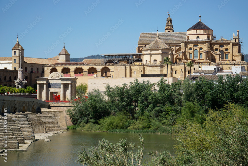 Roman bridge on Guadalquivir River and Mezquita Mosque - Cathedral in Cordoba, Spain