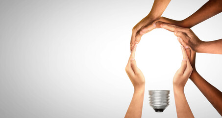 Symbols and shapes of light bulbs created by hand. People thinking together and team ideas coming together joining hands.