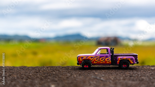 Fototapeta Naklejka Na Ścianę i Meble -  minahasa, Indonesia : January 2023, toy car in the rice field