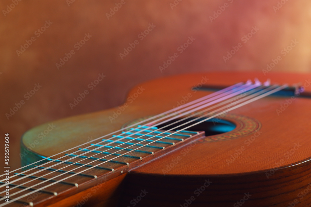 close up guitar and strings ,studio shot , textured background. soft focus, neon color close up guitar and strings ,studio shot , textured background. soft focus, neon color