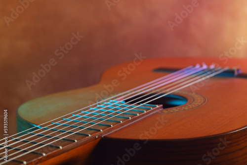close up guitar and strings ,studio shot , textured background. soft focus, neon color