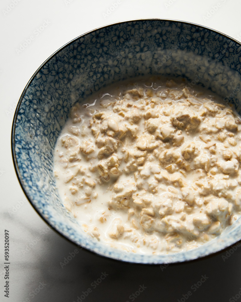Overnight oats with milk and greek yogurt in big bowl. healthy breakfast