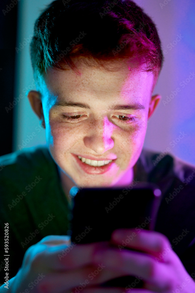 Happy young man surfing net using smart phone Happy young man surfing net using smart phone