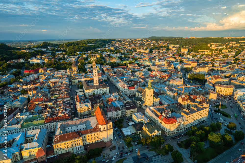 Rooftops of the old town in Lviv in Ukraine. The magical atmosphere of the European city. Landmark, the city hall and the main square. Drone photo.