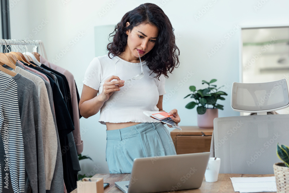 Fashion designer checking color swatch in studio Fashion designer checking color swatch in studio