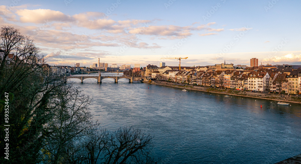 Basel, Bael-Stadt, Switzerland - December 5, 2022: the Rhine with the skyline of the city in the distance