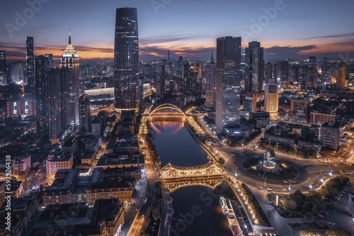 Εκτύπωση καμβά Aerial shot of the city of Tianjin and the River Haihe at sunset, modern citysca