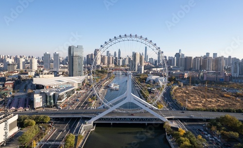 Aerial shot of the Ferris Wheel in Tianjin and the cityscape in the background