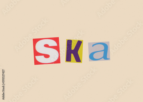 Fotografie Ska word from cut out magazine colored letters on a light background