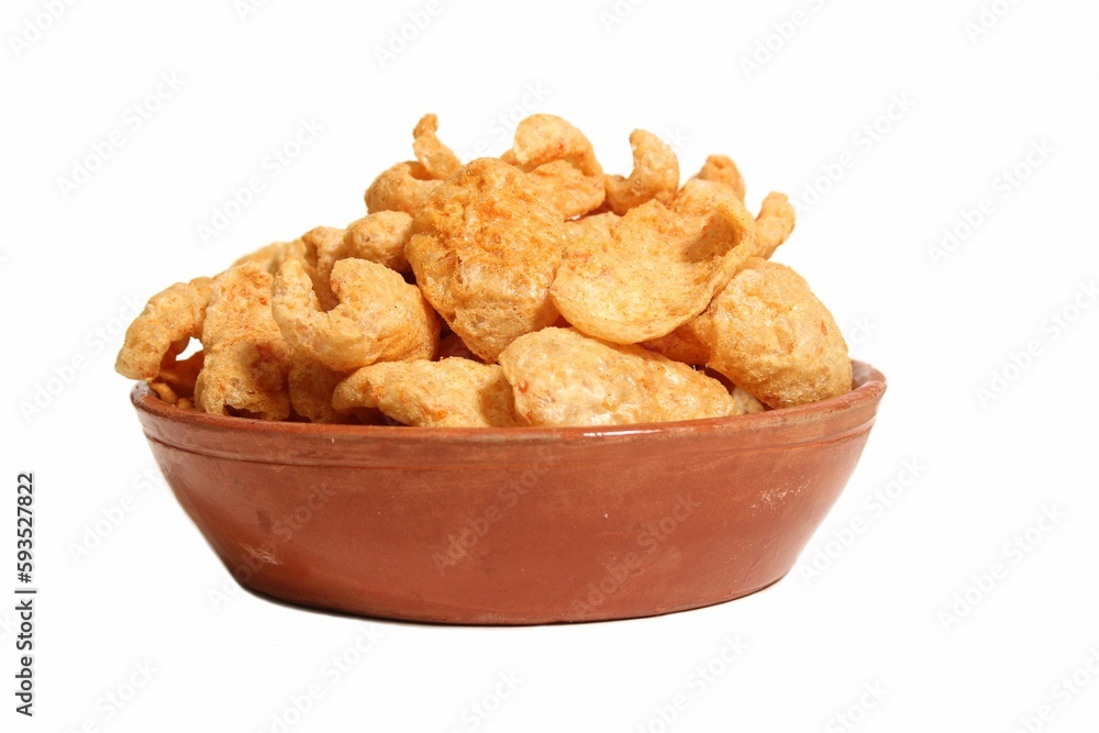Bowl of Fried Pork Rinds Isolated on a White Background Bowl of Fried Pork Rinds Isolated on a White Background
