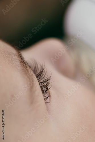 Vertical shot of the eyelashes of the newborn