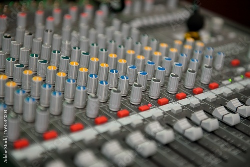 Closeup of colorful mixer knobs and sliders