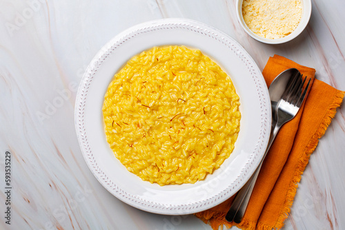 Fotografie, Obraz Italian dish made from saffron, rice, butter, hard cheese and vegetable broth