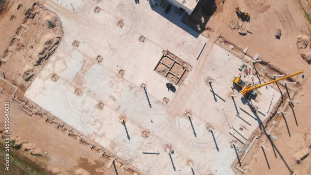 he construction site revolves around a crane in the center, captured on camera he construction site revolves around a crane in the center, captured on camera