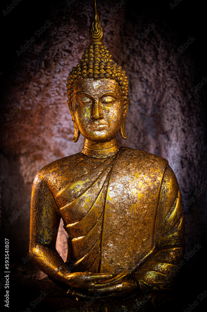 Chainat, April 17 2023.  Wat Klai Kangwon (Wat Khao Sarapatdee Sri Charoentham), An ancient temple dating back to the Lop Buriera(9th-12th century), Golden buddha statue.