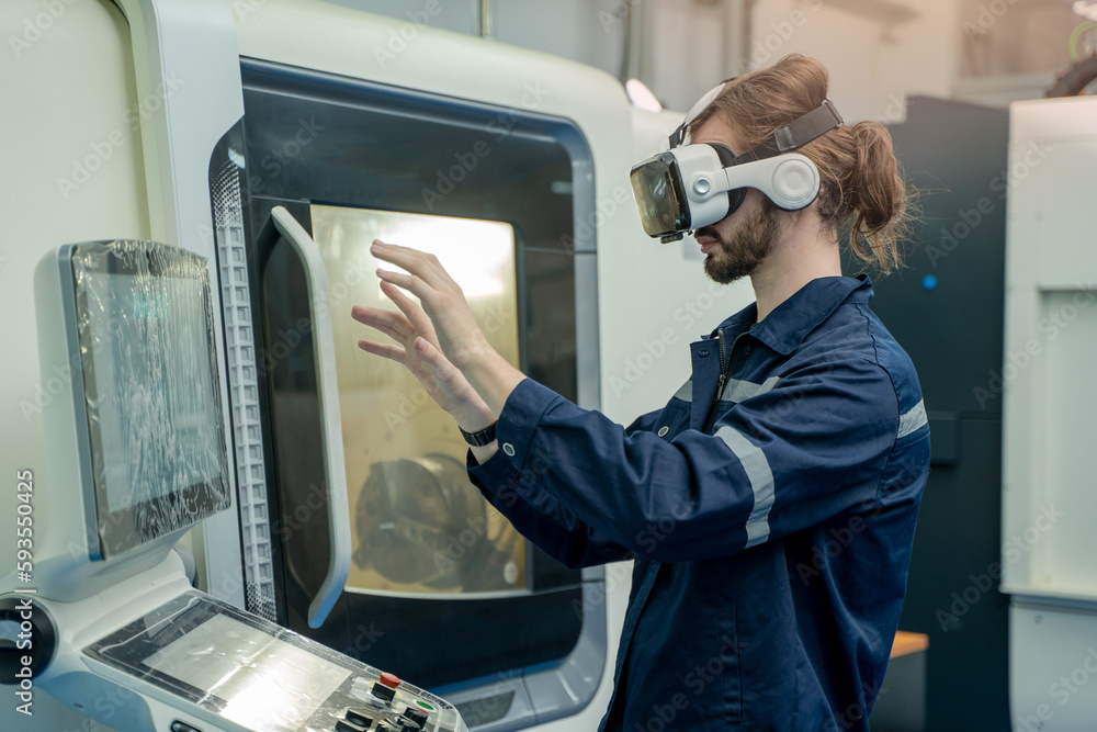Obraz premium Engineer are using virtual AR to maintain and check the work of CNC machine in the 4.0 smart factory.