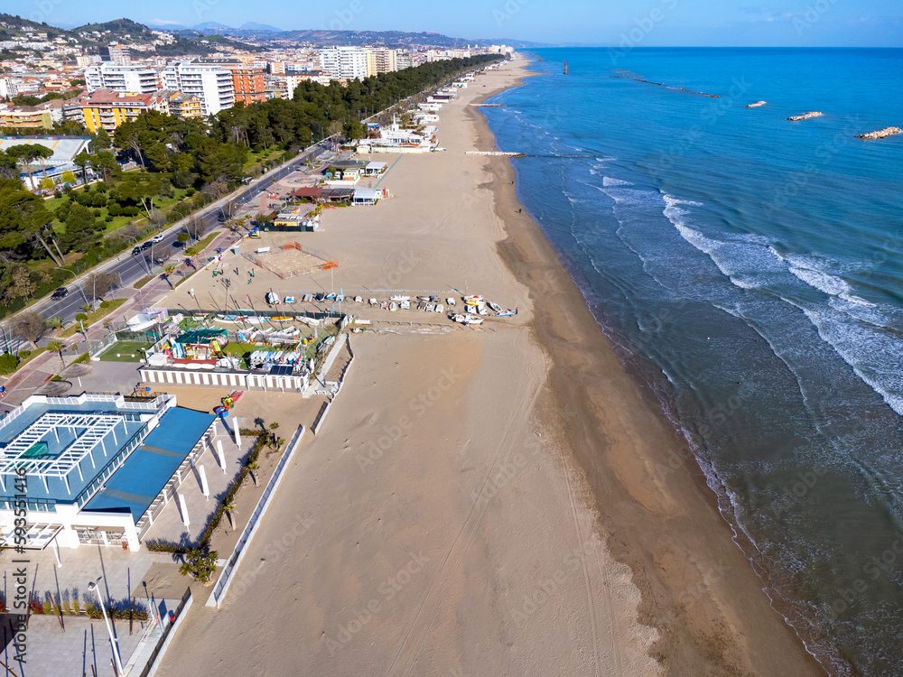 Aerial view landscape Italy Pescara. Long empty beach, sand, sea. Coast, promenade, buildings, estate.