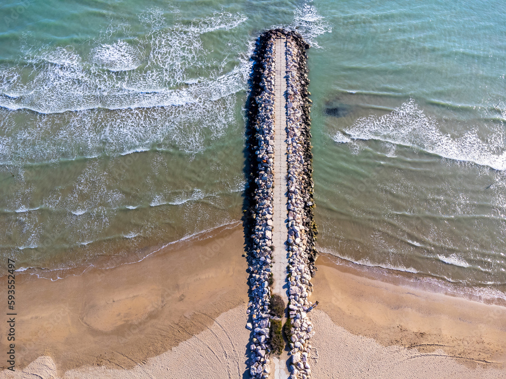 Aerial view landscape. Italy Pescara. Sea, waves, sand , empty beach, stones.