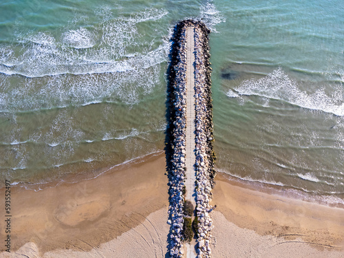Obraz na płótnie Aerial view landscape. Italy Pescara. Sea, waves, sand , empty beach, stones. w salonie