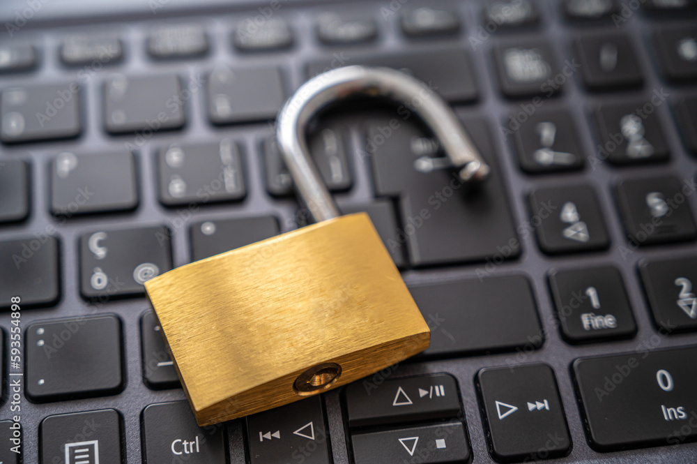 Open padlock, placed above a pc keyboard. Protection of personal and sensitive data, risk of intrusion. Privacy.
Open padlock, placed above a pc keyboard. Protection of personal and sensitive data, risk of intrusion. Privacy.