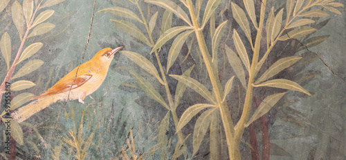 Italy, Pompeii - Luxury roman house interior, fresco detail with bird in a garden photo