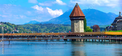 Panoramic view of Lucerne (Luzern) with famous Chapel bridge and Pilatus mountain on background. Switzerland travel and landmarks.