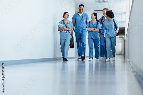 Medical team in training: Group of intern doctors walking in a hospital photo