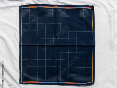 Fotografia Vintage men's dark striped handkerchief on white fabric
