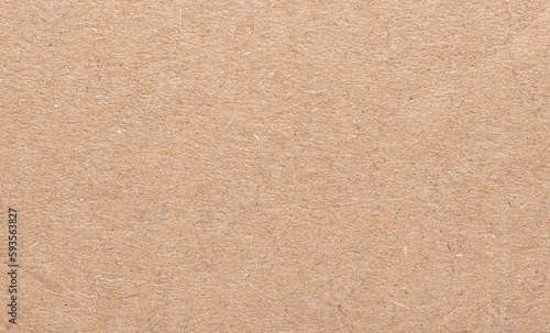 Blank brown cardboard paper with fine texture fiber details, high-resolution background with copy space for text 