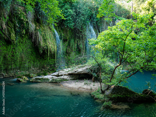 Fototapeta Naklejka Na Ścianę i Meble -  Kursunlu Waterfall, one of the most beautiful places in Antalya, emerging with its unique view and subtropical nature, is located in the central district of Antalya