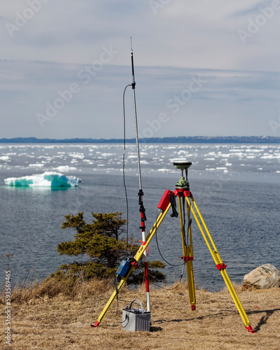 Modern surveying using gps technology near the coastline. Battery power is used for data transmission / receiving.