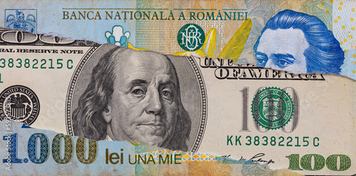 100 dollar banknote through torn Romanian lei banknote
