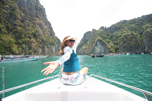 Happy traveler woman enjoys her tropical beach vacation , summer of vacation