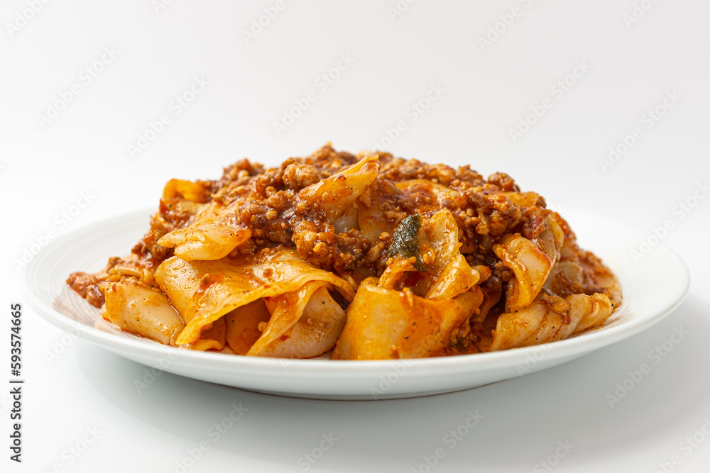 Fried noodles with mala sauce on white background
