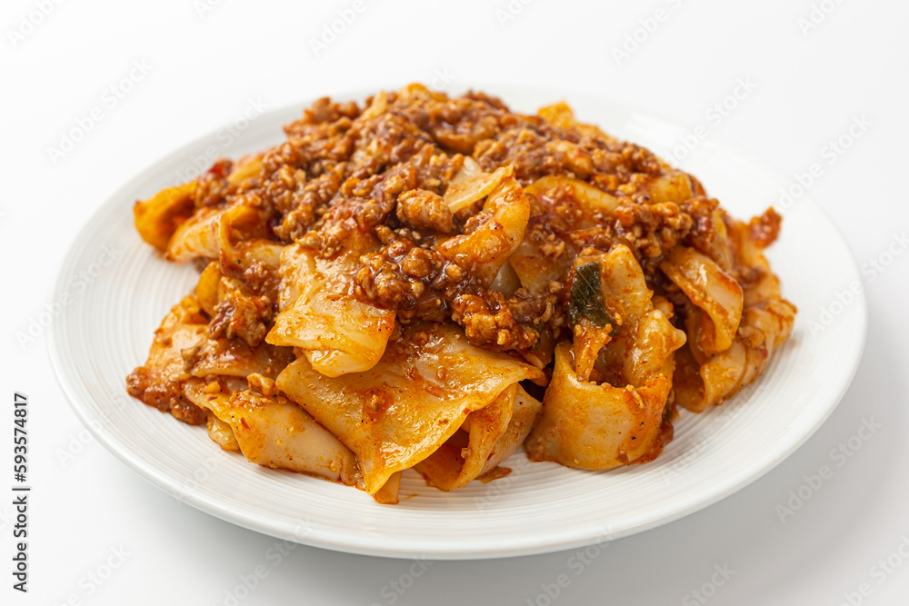 Fried noodles with mala sauce on white background Fried noodles with mala sauce on white background
