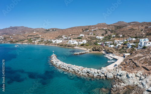 Tinos island, Cyclades Greece. Aerial drone view of Agios Romanos village, blue sea, bay, port.