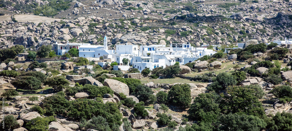 Greece. Tinos island Cyclades. Panoramic view of house at Volax village, granite stone background.