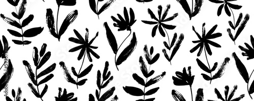 Floral seamless pattern with wild plants. Brush drawn simple abstract flowers. Botanical ornament with dry brush texture. Black and white artistic botanical wallpaper. Chamomile, daisy, chrysanthemums