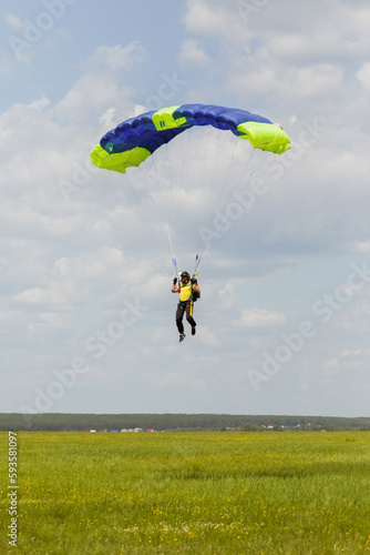 skydiver iwith a wing-type parachute landing