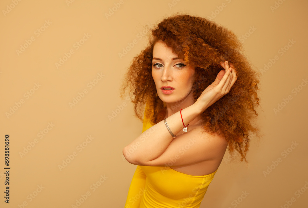 beautiful red haired curly girl in a yellow dress beautiful red haired curly girl in a yellow dress