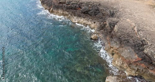 Flight along a cliff with waves