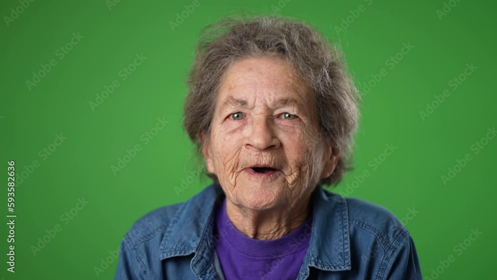 Closeup slow motion portrait of toothless elderly senior old woman with wrinkled skin and grey hair getting great happy with success winner isolated on green screen background. Emotions concept Closeup slow motion portrait of toothless elderly senior old woman with wrinkled skin and grey hair getting great happy with success winner isolated on green screen background. Emotions concept