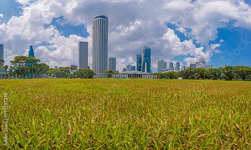 Picture over the historic Padang sports facility in Singapore with the skyline in the background photo