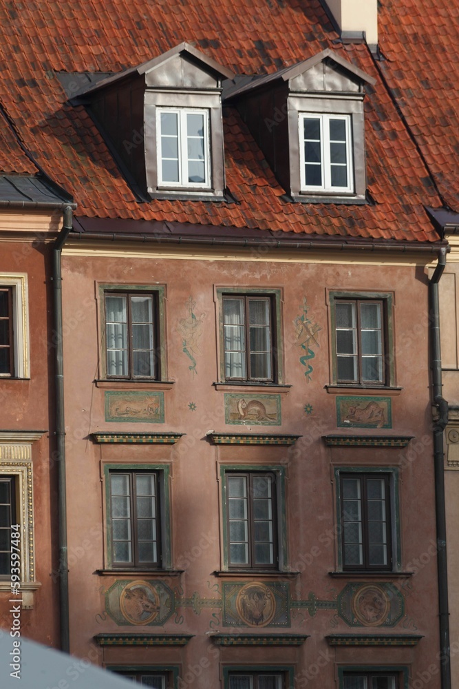 Vertical shot of detail of the adorned facade of a historical building in downtown Warsaw, Poland Vertical shot of detail of the adorned facade of a historical building in downtown Warsaw, Poland