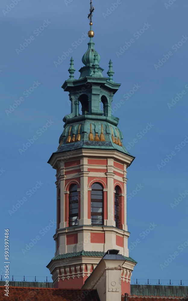 Vertical shot of Adorned tower of a historical building in old town market square, Warsaw, Poland