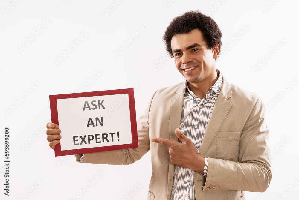 Image of businessman holding paper with text ask an expert. Image of businessman holding paper with text ask an expert.