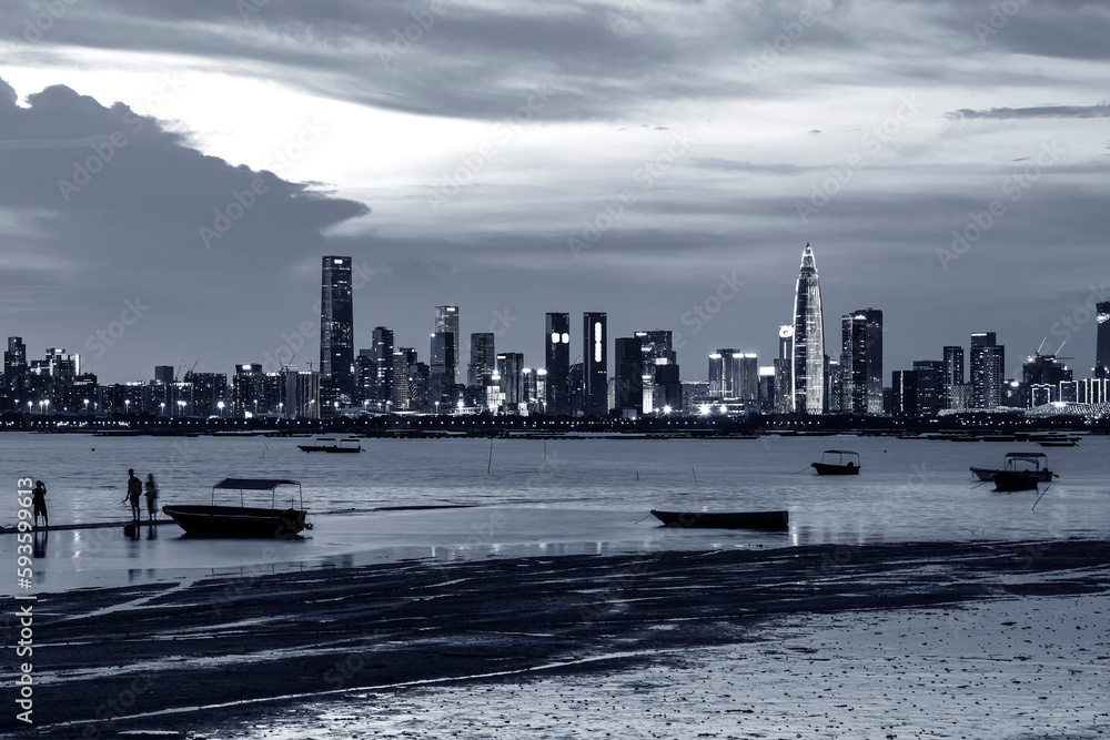 Obraz premium Skyline of Shenzhen city, China at dusk. Viewed from Hong Kong border Lau Fau Shan