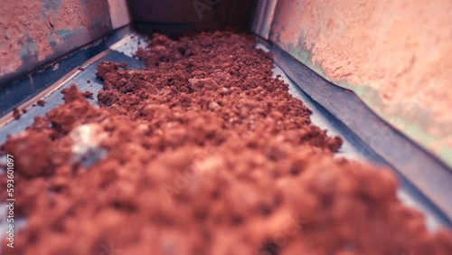 Rocks on belt moving towards camera. Very close. Slow motion 50perc. 4k.